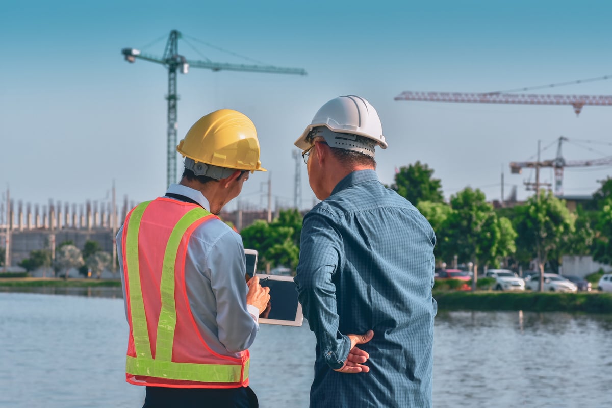 Engineers with Tablet on Site Building Real Estate Construction